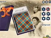 Screenshot of the Fathers Day Gift decoration game showing a tie-shaped gift box being decorated with various patterns, ribbons, and stickers.