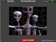 Alien Contact Jigsaw game screenshot showing three friendly, cartoon-style aliens on a piece-by-piece puzzle background. Play free online puzzle game.