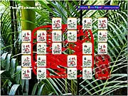 The game board of Mahjong Deluxe, showing various picture pairs of tiles arranged on a timed layout