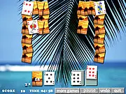 Tropical Solitaire game screen showing a deck of cards laid out on a table with a beautiful beach and ocean background.