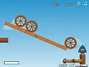 Screenshot of the Scare The Birds online game, showing a platform balanced on a pivot with sleeping birds, and various items ready to be placed to destabilize the structure.