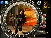 Screenshot of the Dredd: Hidden Alphabets Online game, showing a close-up image from Mega-City One with letters hidden in the scene.