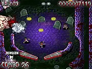 The pinball machine game board of Zombie Pinball set in a spooky graveyard with targets and bumpers