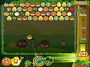 Screenshot of Fruit Faces Bubble Shooter online game, matching 3 or more fruit faces, aiming the shooter at a cluster