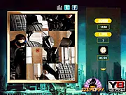 The Dark Knight Rises Puzzle Fun game screen showing scrambled fragments of a movie image featuring Batman or Bane, play free puzzle game online