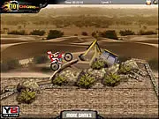 An extreme dirt bike rider navigating treacherous sand dunes and rocky obstacles in the free online game Sahara Biker