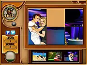Screenshot of Celebrity Sliding Puzzle online game with jumbled tiles showing parts of a celebrity's face