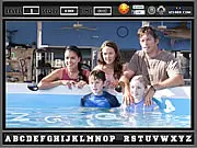 Gameplay screenshot of Dolphin Tale Hidden Alphabets, showing a scene with dolphins underwater where several letters of the alphabet are cleverly hidden.