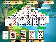Jungle Solitaire free online card game screenshot, pairing cards to 13 (King, Queen, Jack, Ace) in a jungle theme on PlayArcadeHub