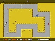 Battletrack combat racing game screenshot showing armed cars shooting at each other while speeding on a track