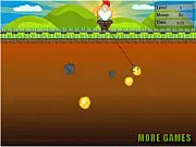 Gnome Miner free online game showing a gnome character lowering a claw to catch a large gold nugget in a mine shaft