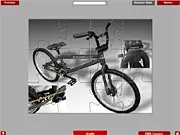 BMX Jigsaw Puzzle Online free game screenshot, solving a 192-piece jigsaw puzzle of a black BMX MD bicycle.