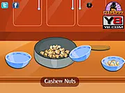 Screenshot of Cashew Caramel Corn Cooking free online game, showing virtual kitchen with popcorn, cashews, and caramel mixture ingredients