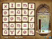 Play Zodiac Master free online. Screenshot of the celestial-themed match 3 puzzle board with horoscope signs.