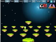 Alien Jumping game screen showing a small green alien character preparing to jump onto a moving platform, play free online arcade game