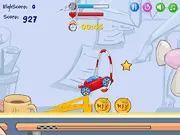 Desktop Racing free online game screenshot. Small race car driving across an office desk with stars to collect.