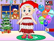 Screenshot of the Cute Christmas Toddler Dress Up game showing the toddler character wearing a Santa costume with holiday accessories