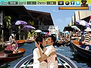 Gameplay screenshot of Guinness Kissing game, showing a cartoon couple kissing with a heart graphic and various distractions to click on