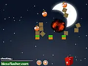 Monster Eliminator game screenshot, a bomb exploding near green monsters and a cute penguin in a physics puzzle