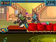 Screenshot of the Oggy The Racer game showing Oggy driving a vehicle on a race track, attempting to collect pieces of chicken while racing against the three mischievous cockroaches.