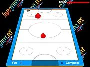 Super Air Hockey game screenshot, puck on the air hockey table, player's paddle hitting the puck towards the goal