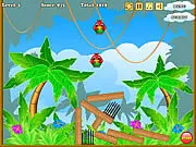 Birds Defenders free online physics puzzle game screenshot showing dynamite and cages on PlayArcadeHub