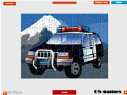 Online puzzle game screenshot for Police Car Jigsaw, showing scattered pieces of a police vehicle ready to be assembled