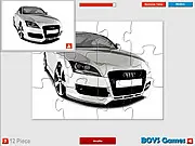 Gameplay screenshot of Audi Super Car Jigsaw showing scrambled puzzle pieces of a beautiful, luxurious Audi sports car.