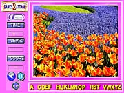 Screenshot of Beauty Flowers: Find the Alphabets free online game showing a beautiful flower garden with several hidden letters subtly blended into the image.