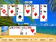 Tropical Coast Solitaire free online card game, colorful tableau of cards set on a sandy tropical beach