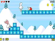 Bounty Hunting Rabbits pixel art game screen showing a small rabbit character jumping over a gap to collect a floating coin.