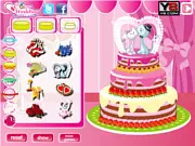 Sweet Wedding Cake 2 free online game screenshot showing a beautifully decorated, tiered wedding cake with flowers and an elegant topper.