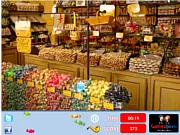 Screenshot from the Candy Shop Hidden Objects online game showing a close-up view of a candy-filled shop with various items cleverly hidden