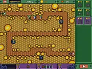 Screenshot of Worlds Guard tower defense game showing various defensive towers placed along a path with enemies advancing, PlayArcadeHub