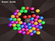 Screenshot of Magnetic Balls online game showing clusters of colored spheres ready to be cleared.