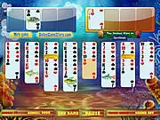 Underwater Solitaire game board with cards arranged over a blue aquatic background with fish, free card game online