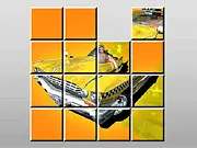 Screenshot of Crazy Taxi Sliding Puzzle online game showing mixed-up square pieces that must be slid to reconstruct the taxi photo