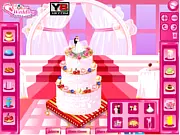 Bridal Shower Cake free online decoration game showing a tiered white cake decorated with pink cream, fruits, and flowers