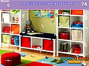 Screenshot of the Modern Study Hidden Alphabets game, showing a contemporary office or study room with a large desk and a bookshelf where letters are subtly hidden.
