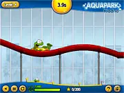 Frog Kulikvak racing down a colorful water slide on a toboggan in the Kvakvapark free online game