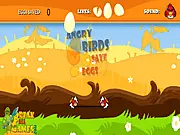 Play Angry Birds Save The Eggs free online arcade game, showing the red bird catching a falling egg