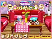 Screenshot of the Decorate Your Coffee Table free online game showing various decor items like candles, vases, and books