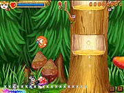 A cute squirrel throwing a block at an enemy in a colorful fantasy world, free Mighty Squirrel online game.