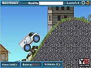 A mail truck balancing precariously on the top of a steep, bumpy hill in the free online driving game