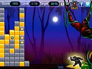 Ninja character poised to throw a shuriken at a wall of two or more red, blue, and green colored blocks descending in the online action-puzzle game Ninja Power Attack