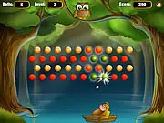 Game screenshot of Binkos the Owl showing the owl preparing to launch a ball at a wall of red tokens and wooden blocks where the monkey Minkey is hiding