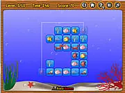Fish Connect gameplay screenshot showing various marine creature tiles on a grid waiting to be matched. Play free online puzzle game on PlayArcadeHub.
