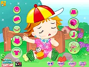Game image of Adorable Baby Girl Dressup showing a cute baby girl wearing a stylish dress and holding a toy for her birthday party