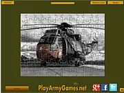Screenshot of Military Helicopter Jigsaw game showing scattered puzzle pieces and a partial image of a military helicopter