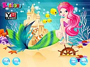 Mermaid Secret Beauty game image showing Princess Amy with a shimmering blue tail, a pink seashell top, and long, flowing hair with decorative bubbles. Play free online dress up game.